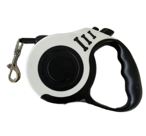 White and black retractable dog leash with ergonomic handle and metal clip for attaching to a collar or harness