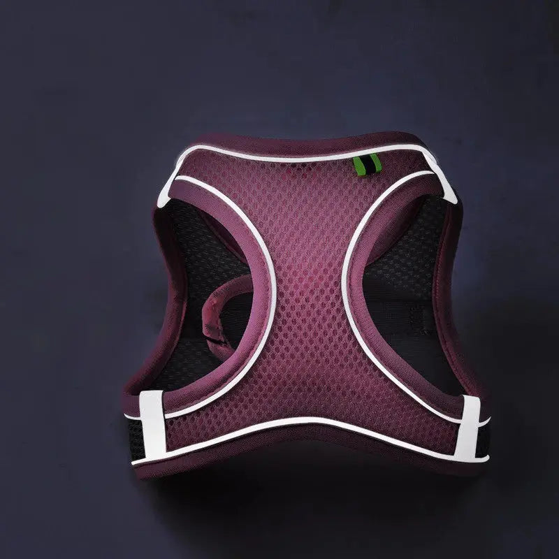 Reflective breathable mesh pet harness with reflective strips, adjustable straps, and a metal D-ring for leash attachment