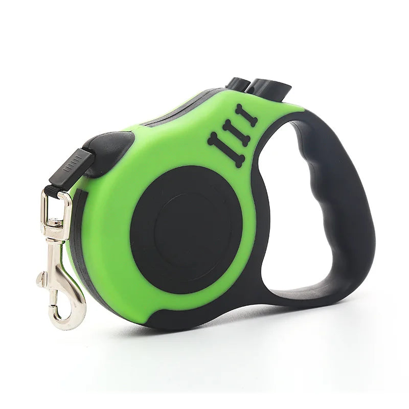 Green and black retractable dog leash with ergonomic handle and metal clip for attaching to a collar or harness