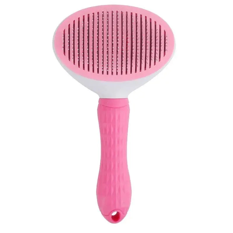 Pink pet grooming brush with a textured handle and oval brush head featuring closely spaced metal bristles