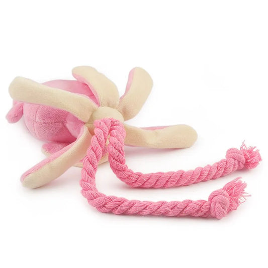 Soft pink and cream plush octopus dog toy with durable twisted rope legs, designed for interactive tugging and chewing play