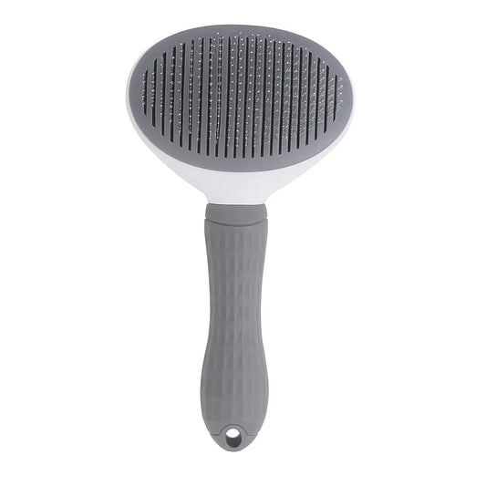 Grey pet grooming brush with a textured handle and oval brush head featuring closely spaced metal bristles