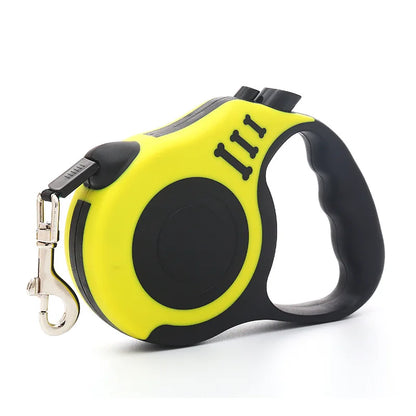 Yellow and black retractable dog leash with ergonomic handle and metal clip for attaching to a collar or harness