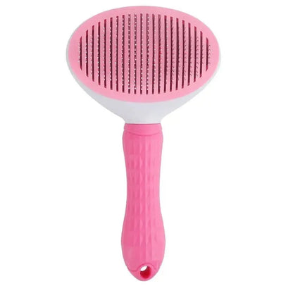 Pink pet grooming brush with a textured handle and oval brush head featuring closely spaced metal bristles